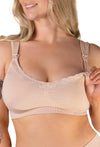A beige, cushion padded, wide strap maternity and nursing bra with soft floral lace on the neckline, displayed on a model.